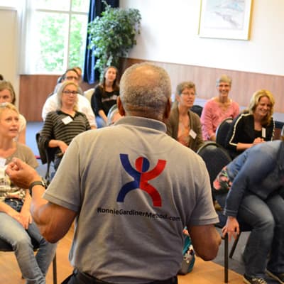 Course participants with enthusiastic faces during an RGM training